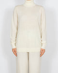 Kremowy wełniany (merino) sweter z golfem Uniqlo