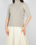 Beżowy (merino) prążkowany sweter marki premium Filippa K. Model swetra: Merino Elbow Sleeve Top.