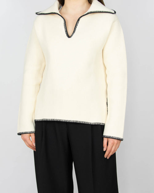 Kremowy bawełniany sweter marki ARKET