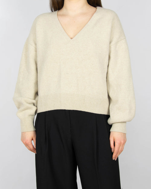 Kremowy (wełna jagnięca) sweter marki H&M Premium