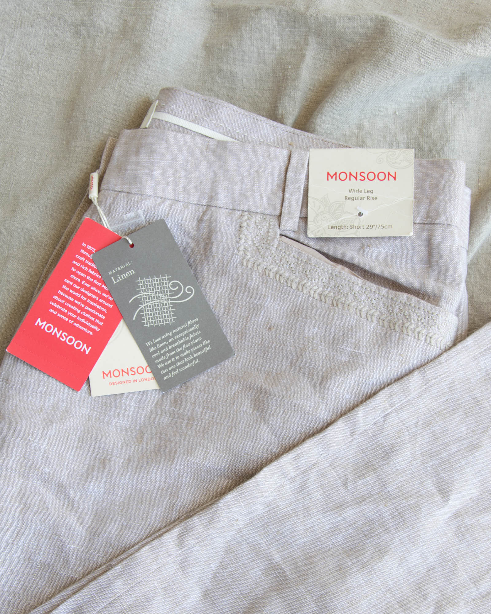 Nowe beżowe lniane spodnie z szeroką nogawką - L